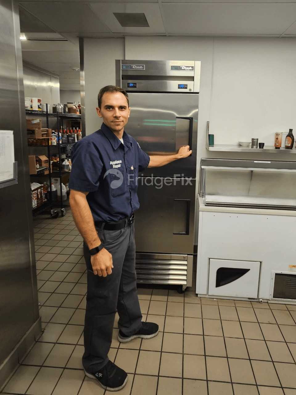 Technician repairing a commercial restaurant range and oven